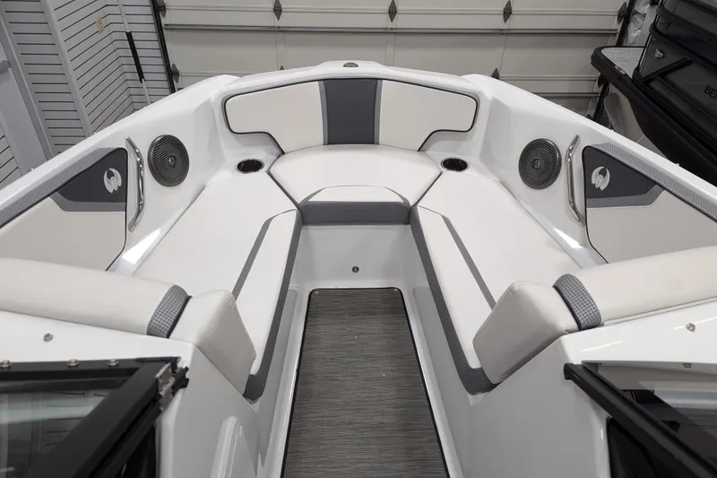 Slide: The Image of 2023 Scarab 195 ID boat interior with white seating and modern design. - 6