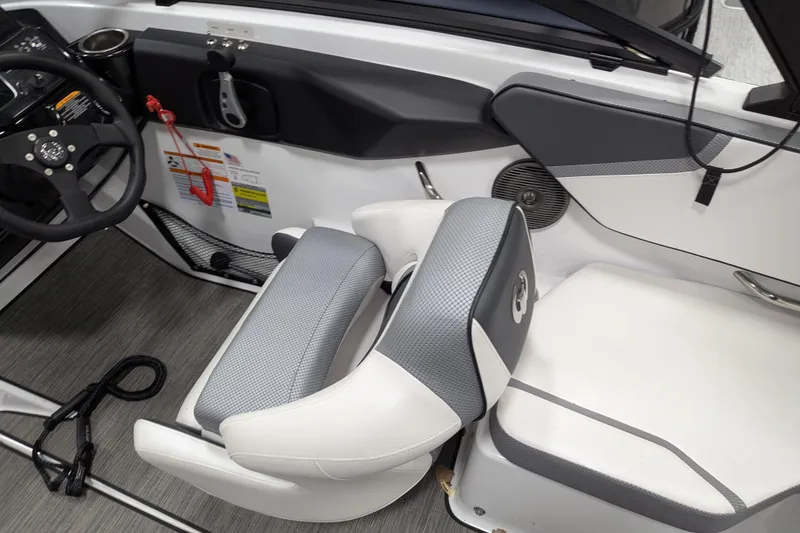 Slide: The Image of Interior of 2023 Scarab 195 ID boat featuring steering wheel and seating. - 9
