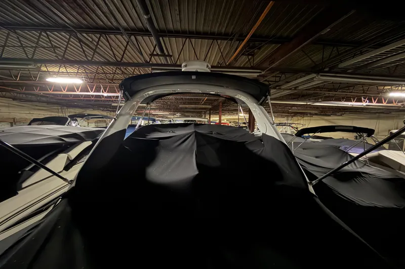 Slide: The Image of 2009 Sea Ray 270 Sundancer boat covered in storage facility. - 18