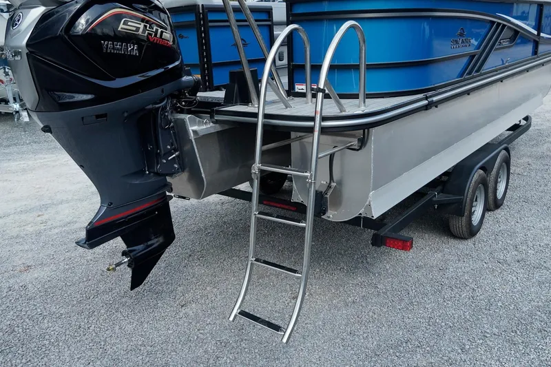 Slide: The Image of 2025 SunCatcher Fusion 324RCX boat with Yamaha motor and ladder on trailer. - 10