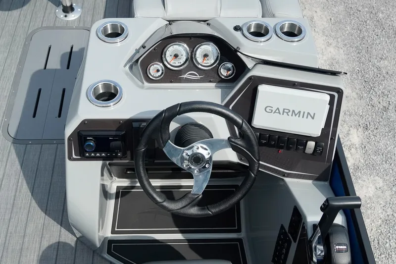 Slide: The Image of 2025 SunCatcher Fusion 324RCX boat dashboard with Garmin navigation system and modern controls. - 11