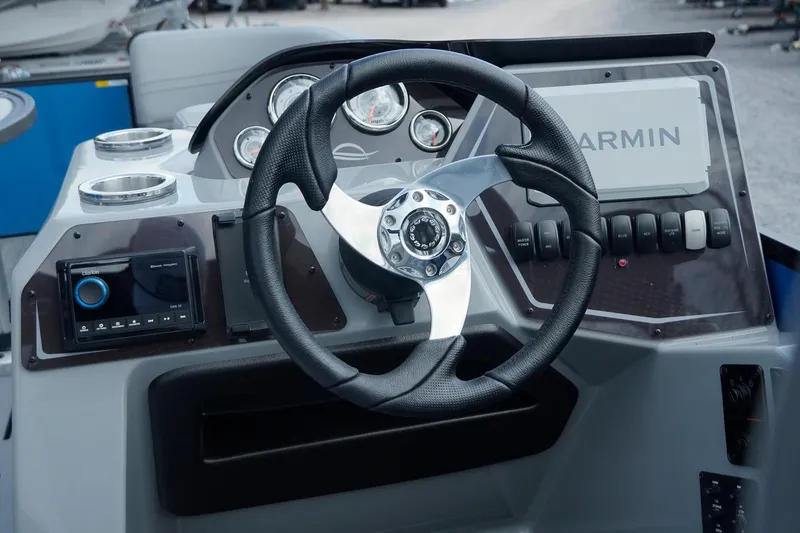 Slide: The Image of Steering console of 2025 SunCatcher Fusion 324RCX with Garmin navigation system. - 12