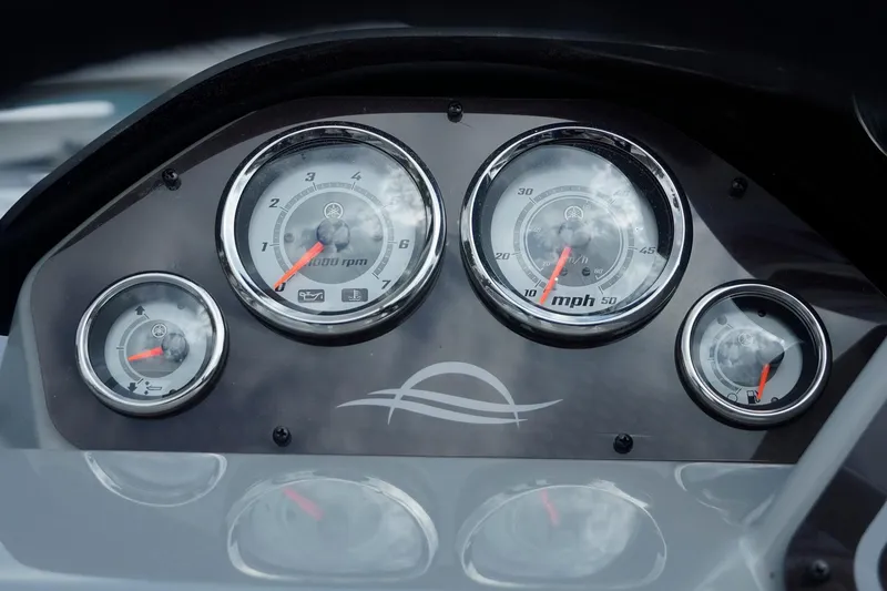 Slide: The Image of Dashboard of 2025 SunCatcher Fusion 324RCX with speedometer and tachometer gauges. - 13