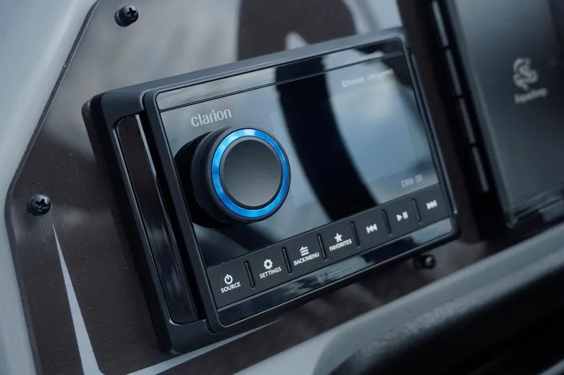 Slide: The Image of Clarion audio system in 2025 SunCatcher Fusion 324RCX boat dashboard. - 14