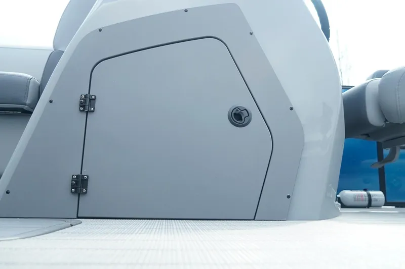 Slide: The Image of 2025 SunCatcher Fusion 324RCX boat interior storage compartment with sleek design and modern finish. - 18