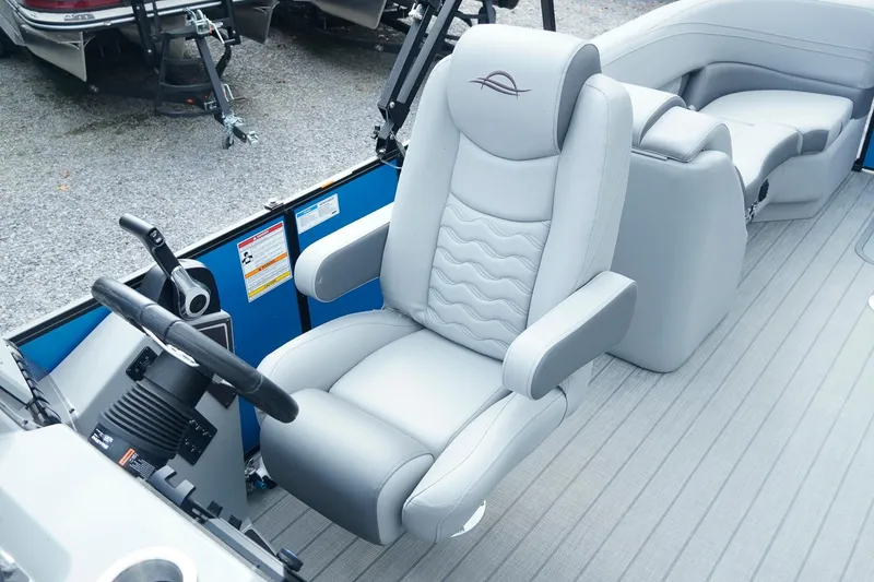 Slide: The Image of Captain's chair in 2025 SunCatcher Fusion 324RCX boat, featuring sleek design and comfortable seating. - 19