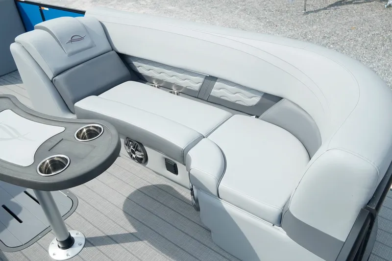 Slide: The Image of Luxurious seating on 2025 SunCatcher Fusion 324RCX boat with cup holders and speaker system. - 22