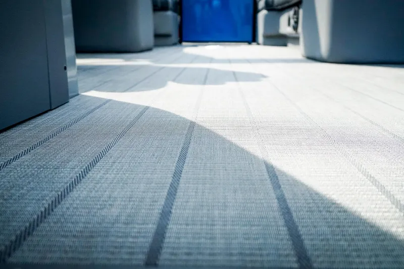 Slide: The Image of 2025 SunCatcher Fusion 324RCX interior flooring with modern design and soft lighting. - 33