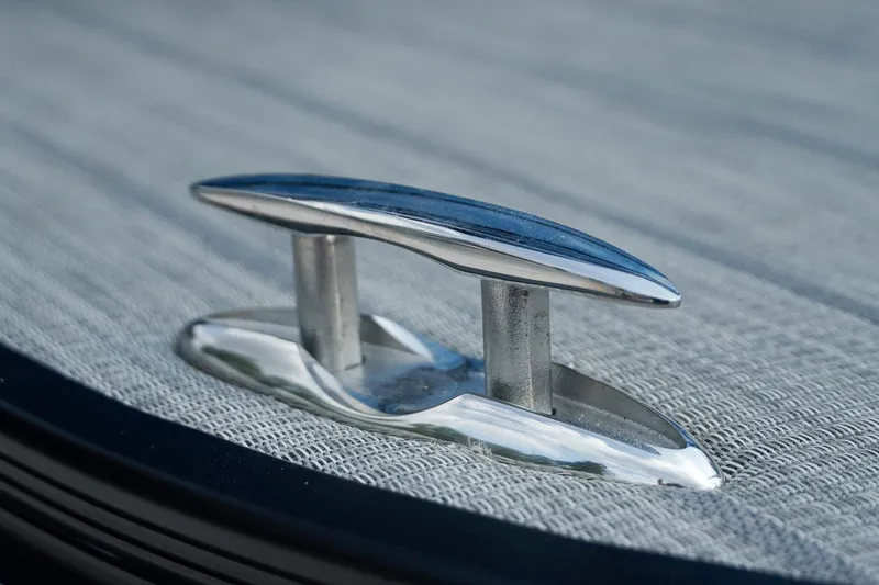 Slide: The Image of Close-up of a cleat on a 2025 SunCatcher Fusion 324RCX boat deck. - 35