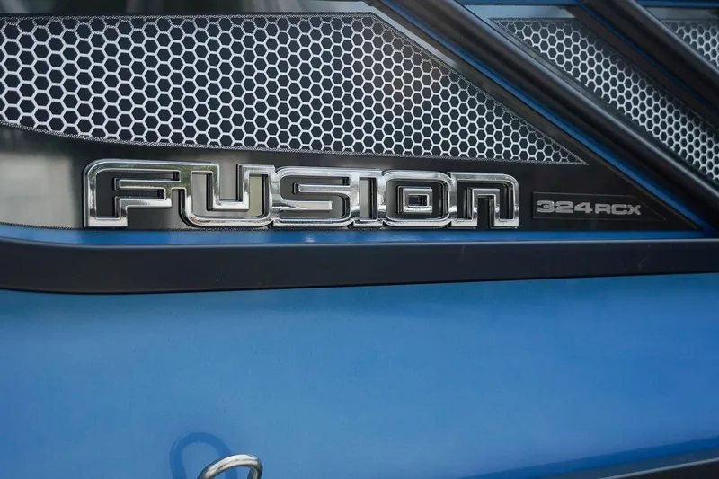 Slide: The Image of 2025 SunCatcher Fusion 324RCX logo on blue background with honeycomb pattern. - 36