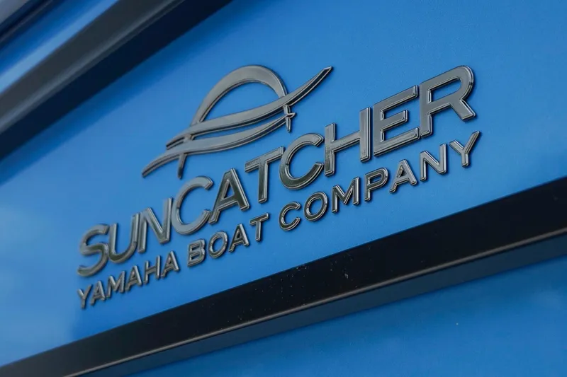 Slide: The Image of SunCatcher Yamaha Boat Company logo on blue background, 2025 Fusion 324RCX model. - 37