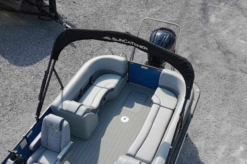 Slide: The Image of 2025 SunCatcher Fusion 324RCX pontoon boat with spacious seating and sleek design. - 7