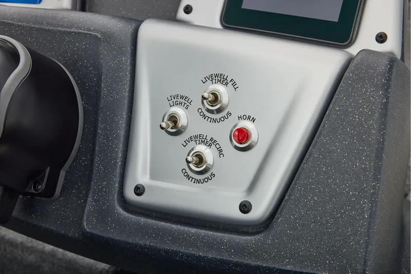 Slide: The Image of Manufacturer Provided Image: Control panel of 2026 Tracker Pro Team 195 boat with switches and horn button. - 43