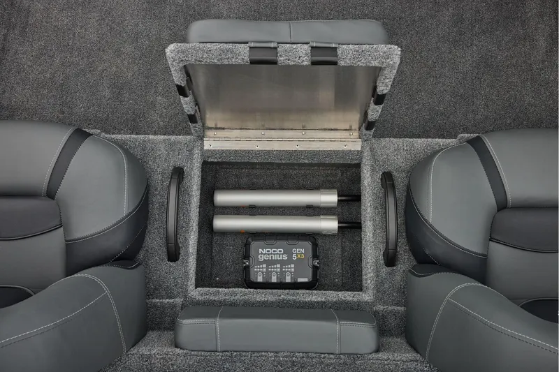 Slide: The Image of Manufacturer Provided Image: Interior of 2026 Tracker Pro Team 195 boat with storage compartment and NOCO Genius charger. - 45