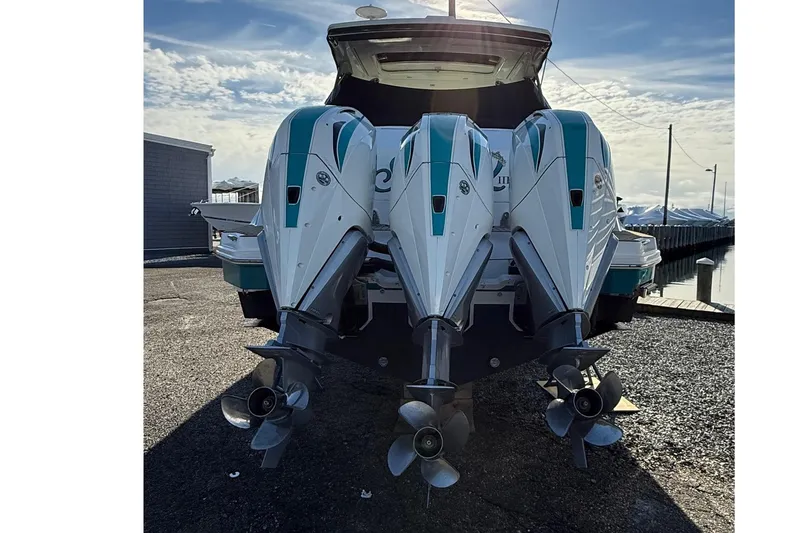 Slide: The Image of 2021 Sea Ray Sundancer 320 Coupe Outboard with triple engines at dockside. - 6