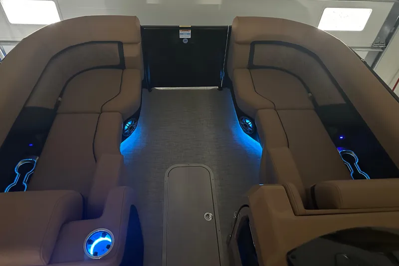 Slide: The Image of Interior of 2026 Godfrey AquaPatio 255 DFL with purple LED lighting and speakers. - 10