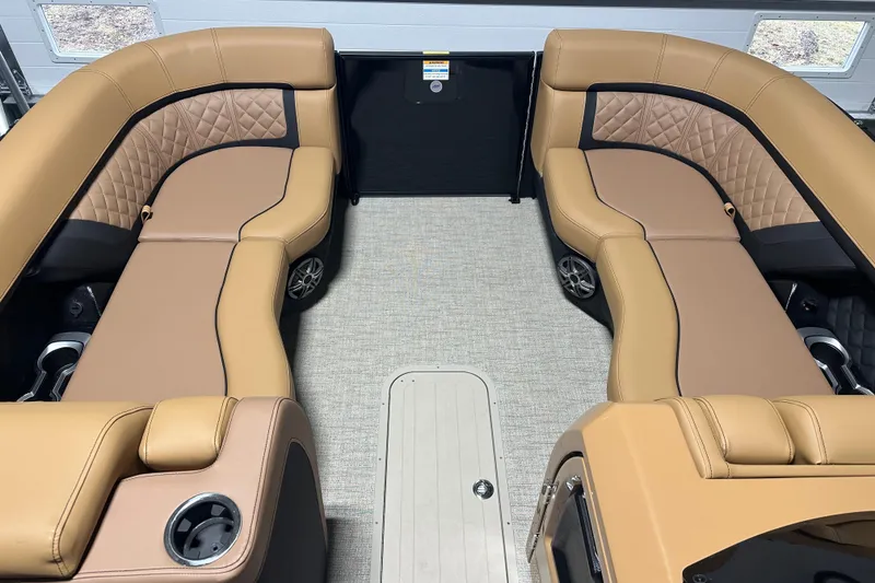 Slide: The Image of Luxurious interior of 2026 Godfrey AquaPatio 255 DFL pontoon boat with tan seating. - 13