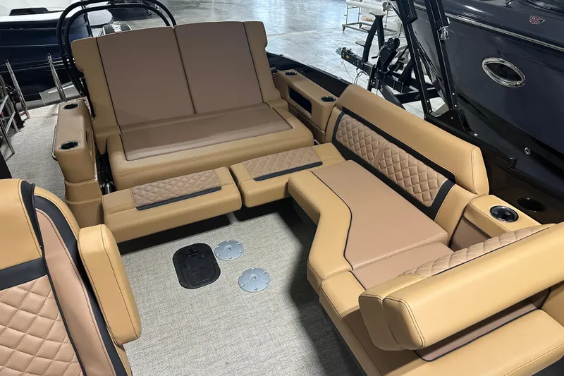 Slide: The Image of Luxurious helm seat of 2026 Godfrey AquaPatio 255 DFL pontoon boat. - 17