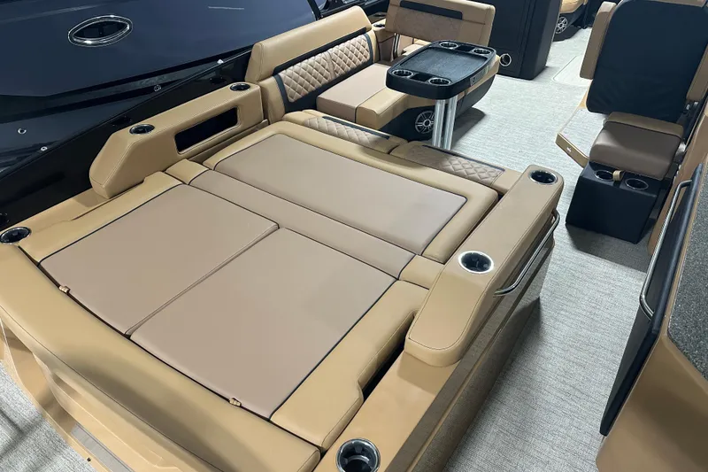 Slide: The Image of Luxurious interior of 2026 Godfrey AquaPatio 255 DFL pontoon boat with tan seating and table. - 19