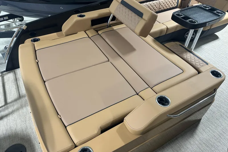 Slide: The Image of Luxurious interior of 2026 Godfrey AquaPatio 255 DFL pontoon boat with plush seating and cup holders. - 20