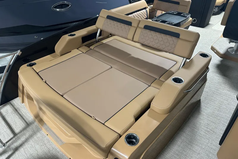 Slide: The Image of Luxurious seating on 2026 Godfrey AquaPatio 255 DFL pontoon boat with cup holders and table. - 21