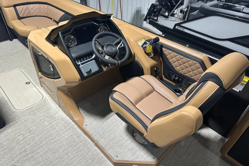 Slide: The Image of Luxurious seating on 2026 Godfrey AquaPatio 255 DFL pontoon boat, featuring tan upholstery. - 22