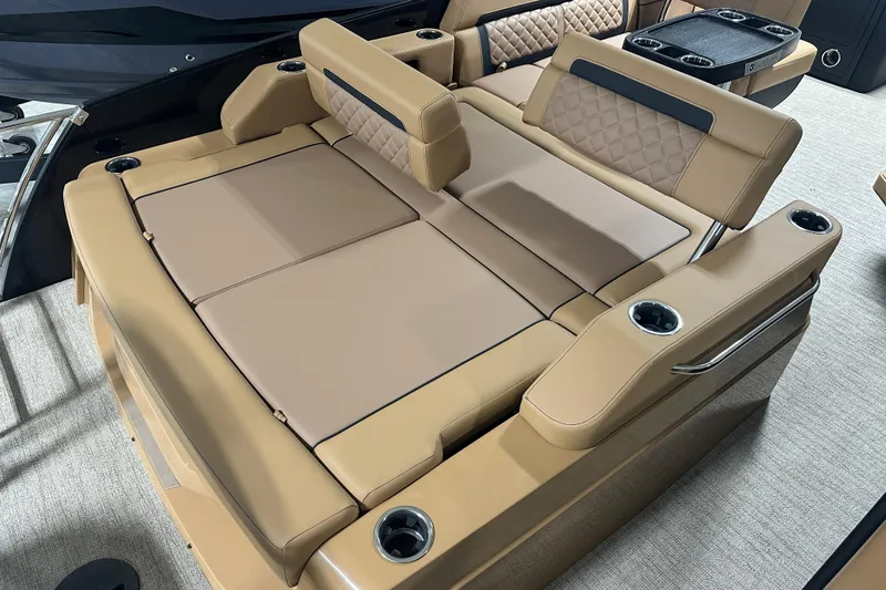 Slide: The Image of Luxurious interior of 2026 Godfrey AquaPatio 255 DFL pontoon boat with tan leather seating. - 23