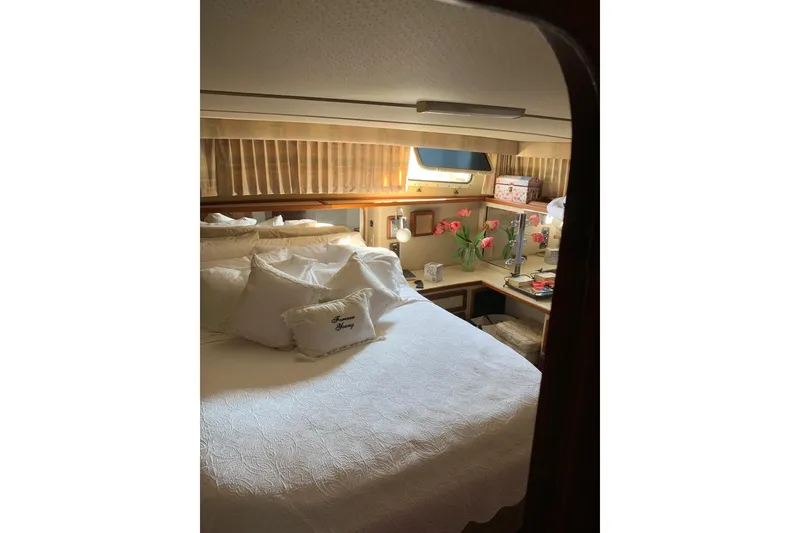 Slide: The Image of 1985 Chris-Craft 426 Catalina yacht interior with wicker chairs and ocean view. - 12