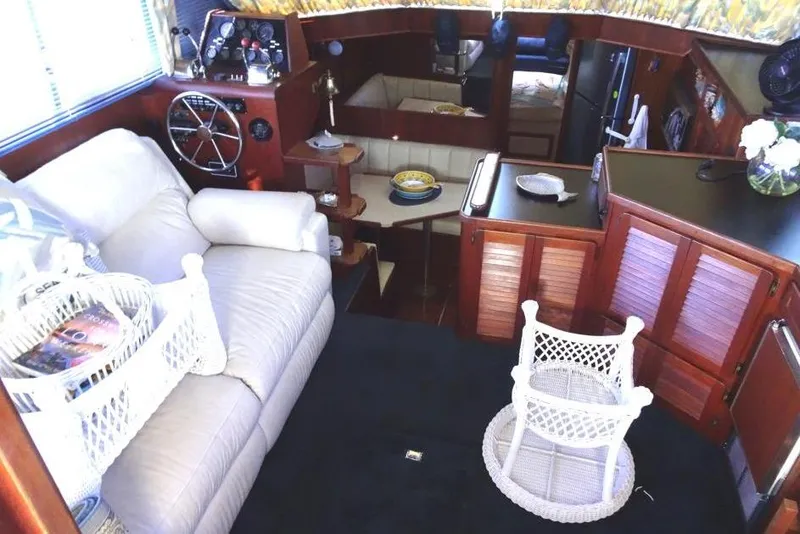 Slide: The Image of 1985 Chris-Craft 426 Catalina helm with steering wheel, controls, and navigation equipment. - 6