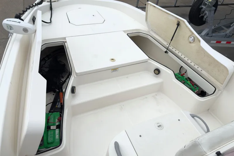 Slide: The Image of 2022 Bayliner Trophy T21Bay boat interior with open storage compartments. - 12