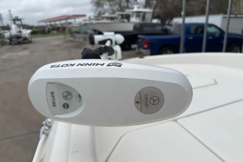 Slide: The Image of Minn Kota Riptide motor on 2022 Bayliner Trophy T21Bay boat, parked outdoors. - 13