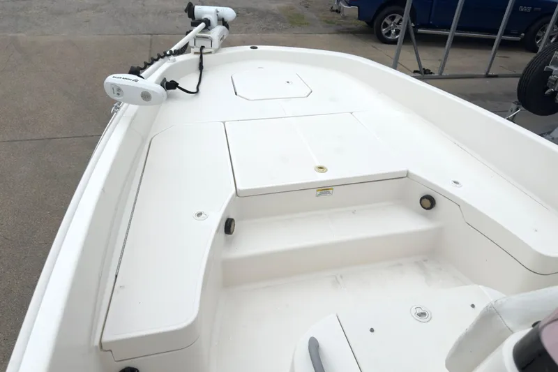 Slide: The Image of 2022 Bayliner Trophy T21Bay boat deck with trolling motor, parked on concrete. - 7