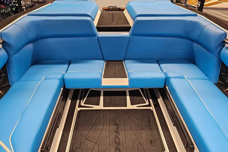 Slide: The Image of 2026 Moomba Max boat interior with blue seating and sleek design. - 10