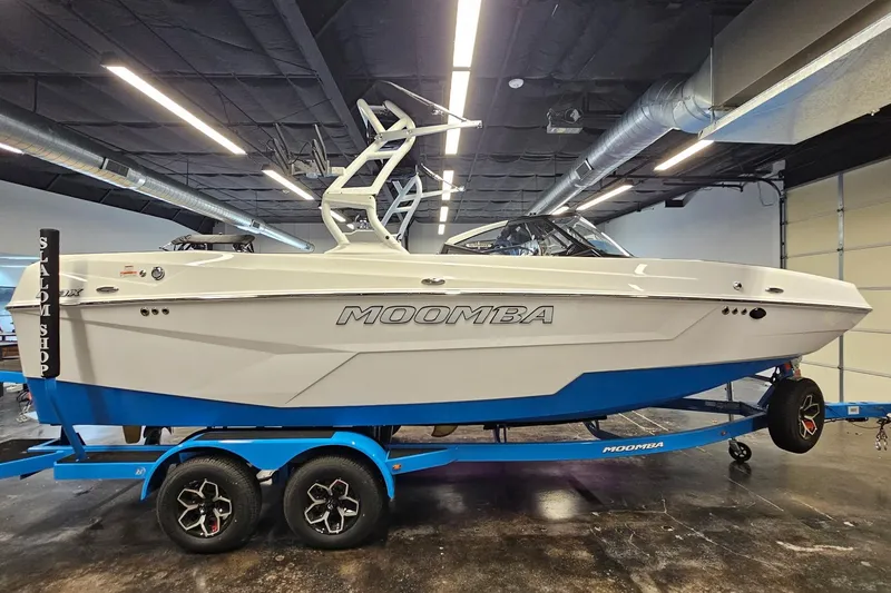 Slide: The Image of 2026 Moomba Max boat on trailer in indoor showroom setting. - 5