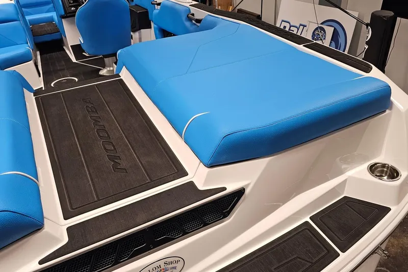 Slide: The Image of 2026 Moomba Max boat interior with blue seating and black flooring. - 7