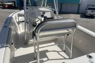 Slide: The Image of 2023 Sailfish 220 CC boat interior with steering console and seating. - 7