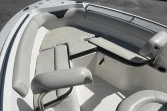 Slide: The Image of 2023 Sailfish 220 CC boat interior with cushioned seating and sleek design. - 9