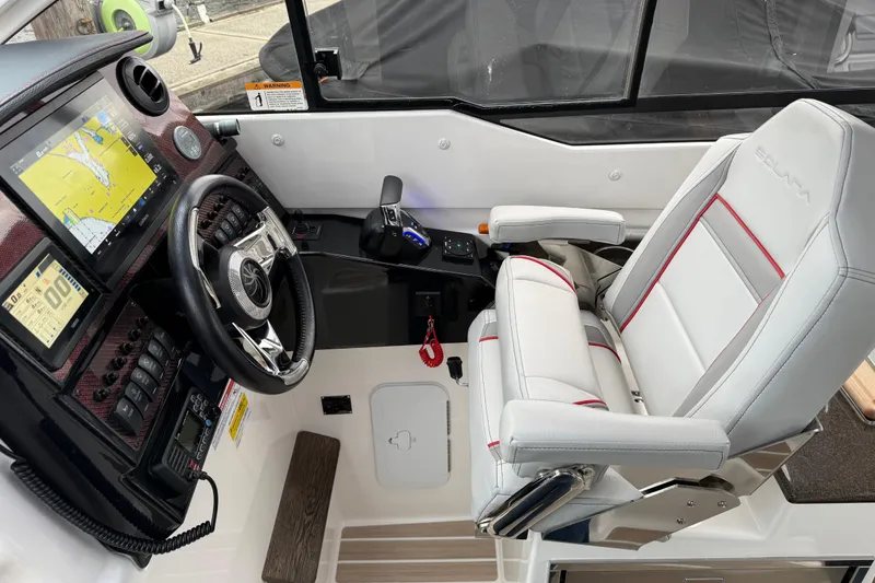 Slide: The Image of 2024 Solara S-250 Coupe cockpit with advanced navigation and luxurious seating. - 13