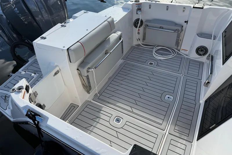 Slide: The Image of 2024 Solara S-250 Coupe boat interior with sleek seating and modern deck design. - 2