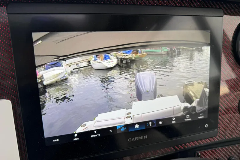 Slide: The Image of Garmin display showing rear view of docked boats, Solara S-250 Coupe, 2024 model. - 20