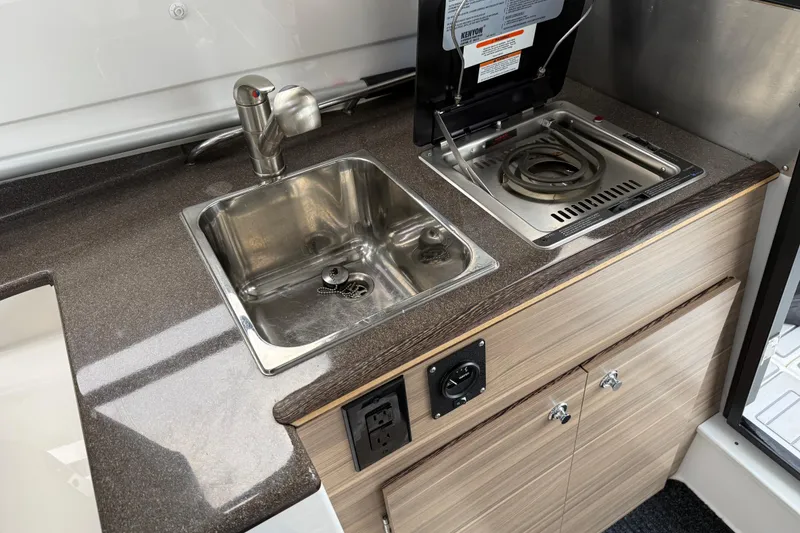 Slide: The Image of Compact kitchenette in 2024 Solara S-250 Coupe with sink and stove. - 26