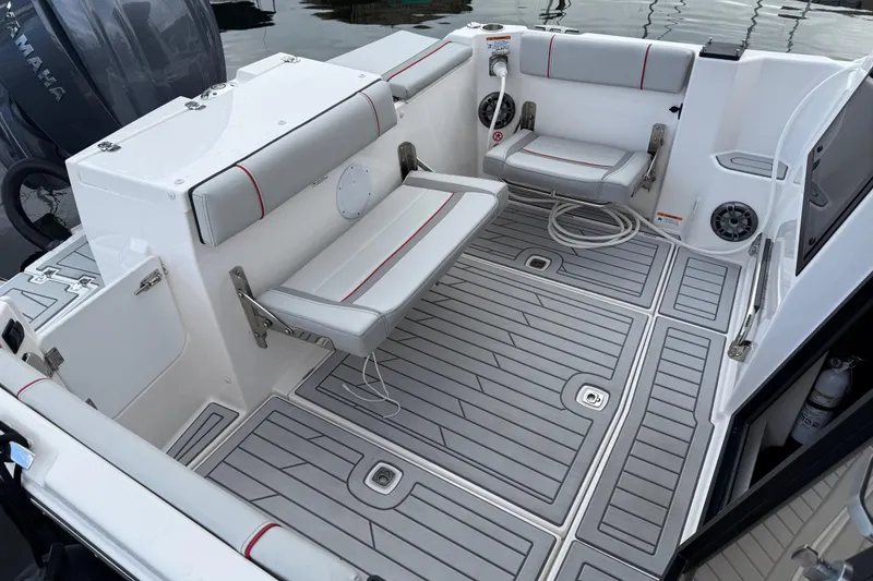Slide: The Image of 2024 Solara S-250 Coupe boat interior with gray seating and deck, featuring Yamaha engine. - 3
