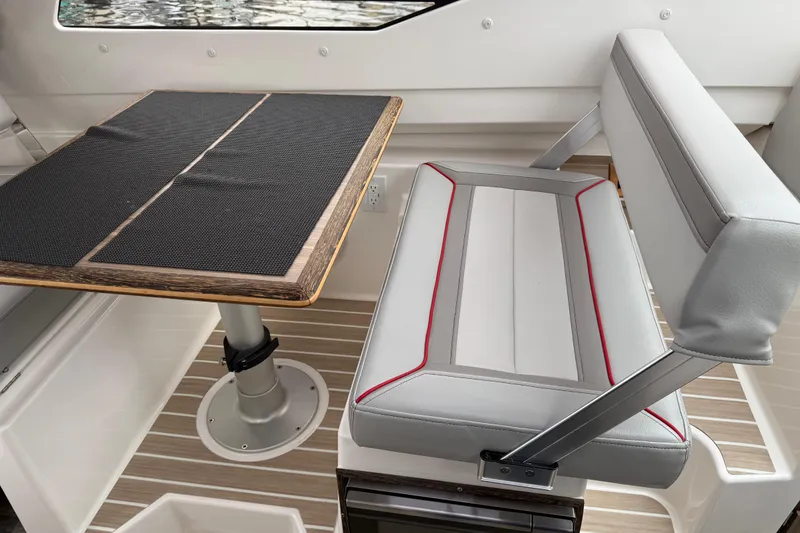 Slide: The Image of 2024 Solara S-250 Coupe interior with sleek seating and modern table design. - 30