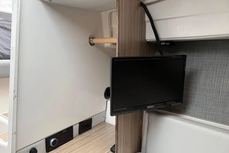 Slide: The Image of 2024 Solara S-250 Coupe interior with mounted TV and modern design elements. - 36