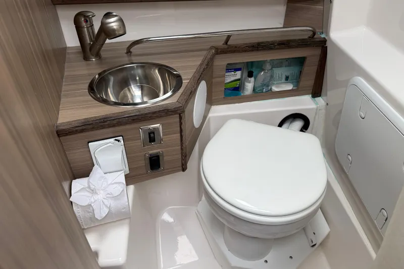 Slide: The Image of 2024 Solara S-250 Coupe bathroom with compact sink, toilet, and storage. - 37