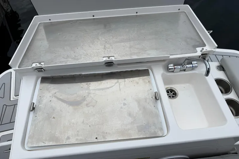 Slide: The Image of 2024 Solara S-250 Coupe boat sink and prep station with faucet and storage. - 43