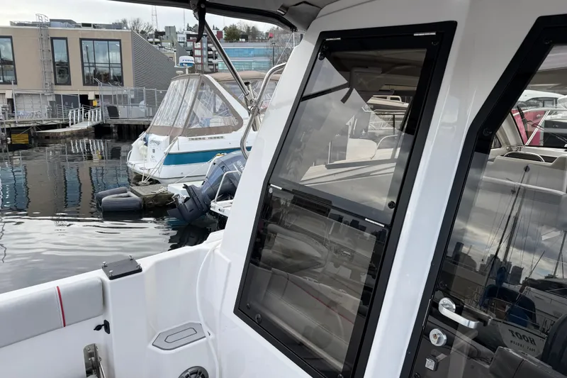 Slide: The Image of 2024 Solara S-250 Coupe at marina, showcasing sleek design and modern features. - 5