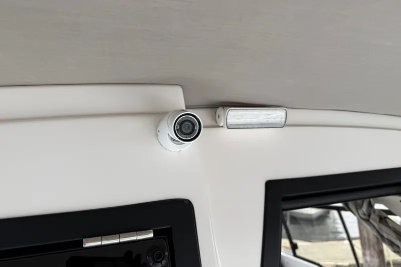 Slide: The Image of 2024 Solara S-250 Coupe interior with security camera and light fixture. - 52