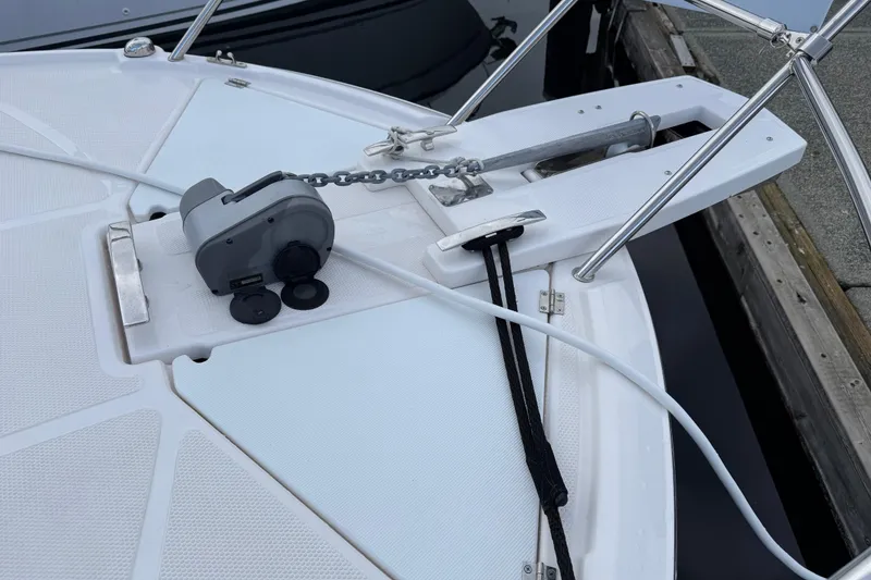 Slide: The Image of 2024 Solara S-250 Coupe boat anchor system with chain and winch on deck. - 58