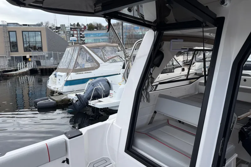 Slide: The Image of 2024 Solara S-250 Coupe docked at marina, showcasing sleek design and modern interior. - 6